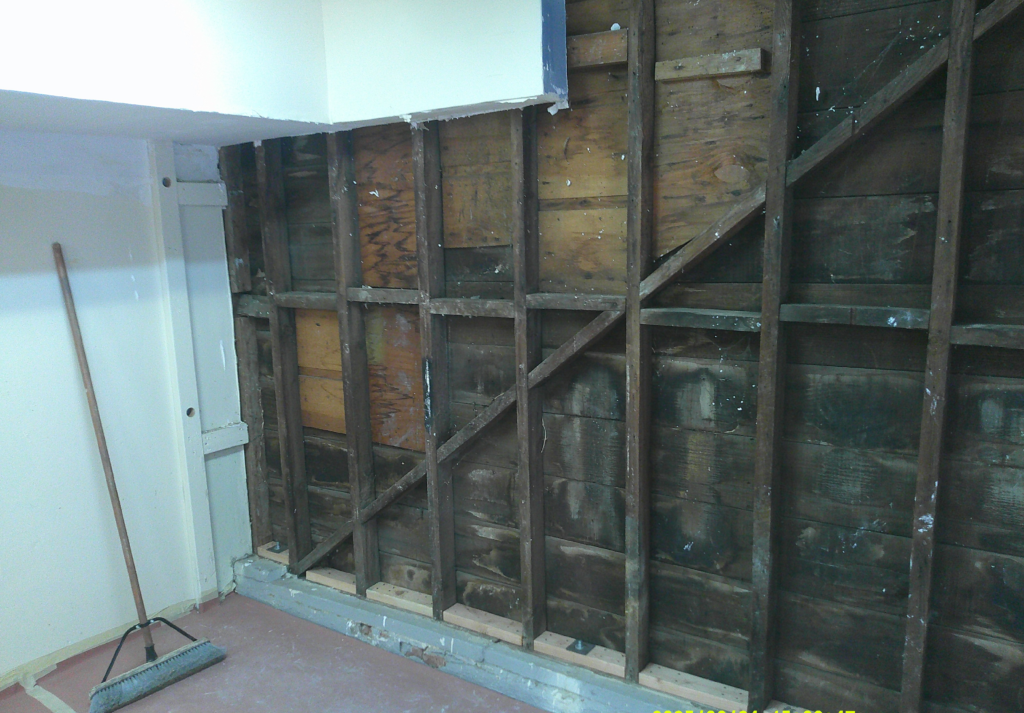 Unbraced wood cripple wall inside a raised-foundation crawlspace in San Diego before seismic reinforcement