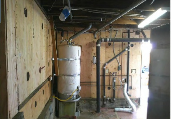 Completed plywood cripple wall bracing and foundation anchorage inside a San Diego raised-foundation crawlspace after seismic retrofit