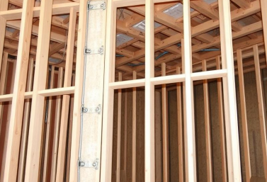 crawlspace-structural-reinforcement-san-diego.webp Structural reinforcement including plywood bracing and support connections inside a multi-unit raised-foundation crawlspace in San Diego