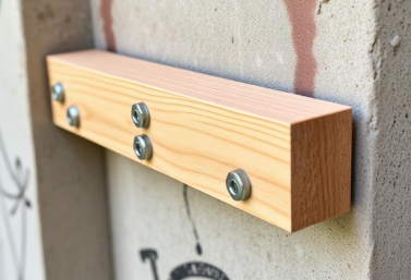sill-plate-anchorage-seismic-retrofit-san-diego.webp Sill plate anchorage with metal brackets and bolts securing wood framing to concrete foundation in San Diego seismic retrofit work