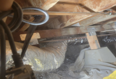 crawlspace-structural-reinforcement-san-diego.webp Structural reinforcement including plywood bracing and support connections inside a multi-unit raised-foundation crawlspace in San Diego